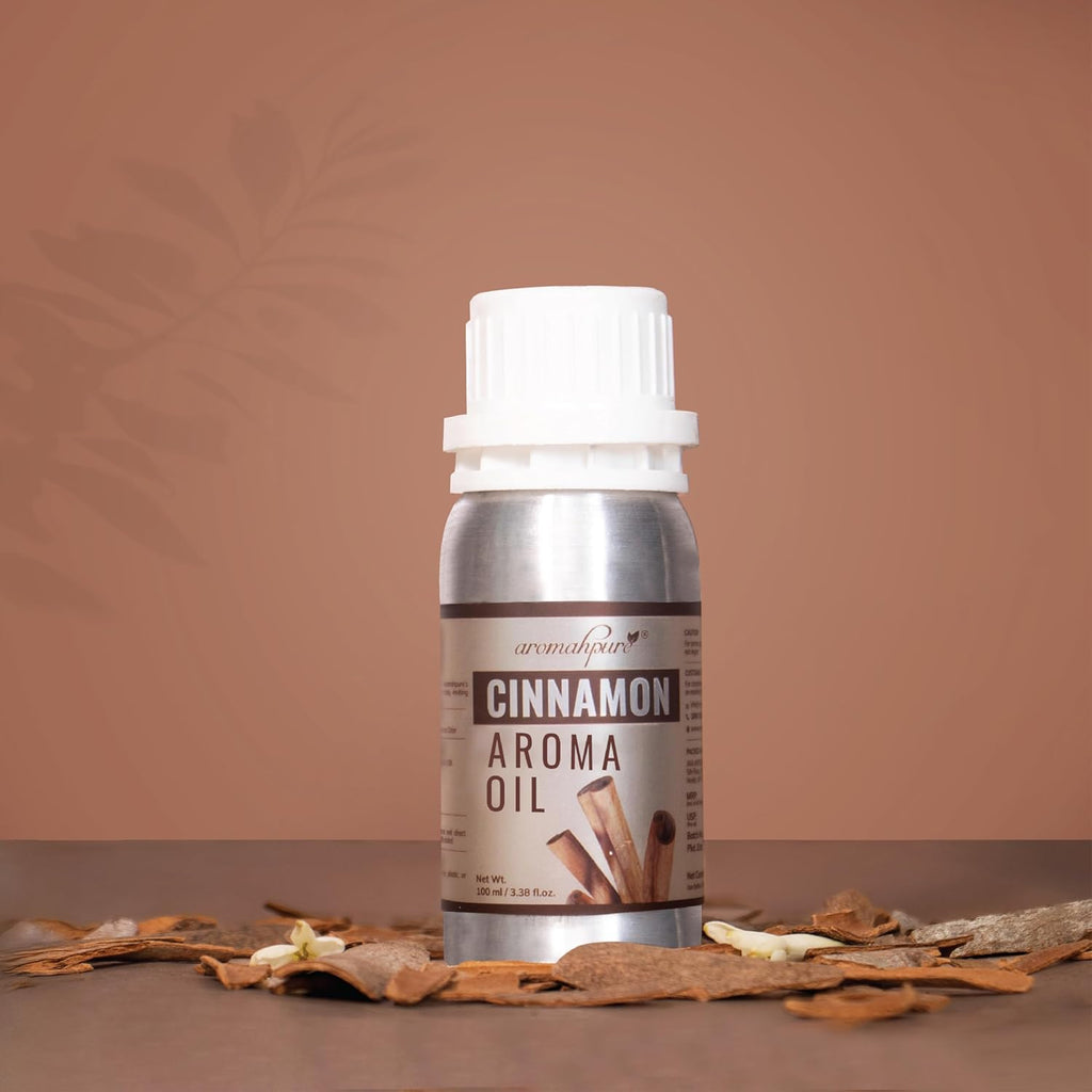 Bottle of cinnamon aroma oil with cinnamon sticks on a brown background