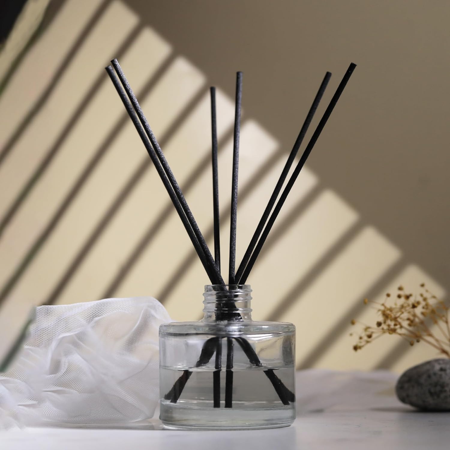 diffuser bottle with black reed sticks