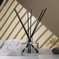 diffuser bottle with black reed sticks