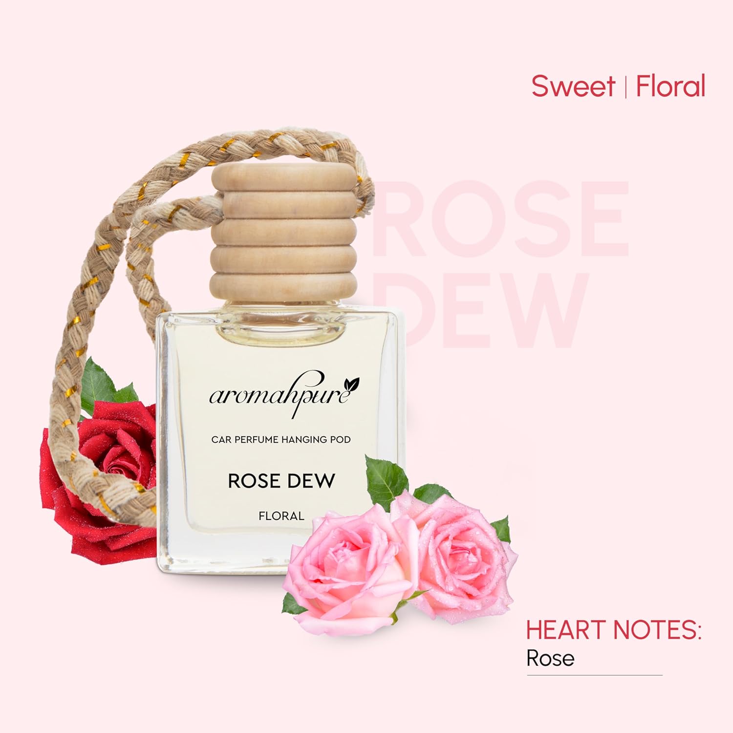 Aromaphoria Rose Dew car perfume hanging pod with roses on a light pink background