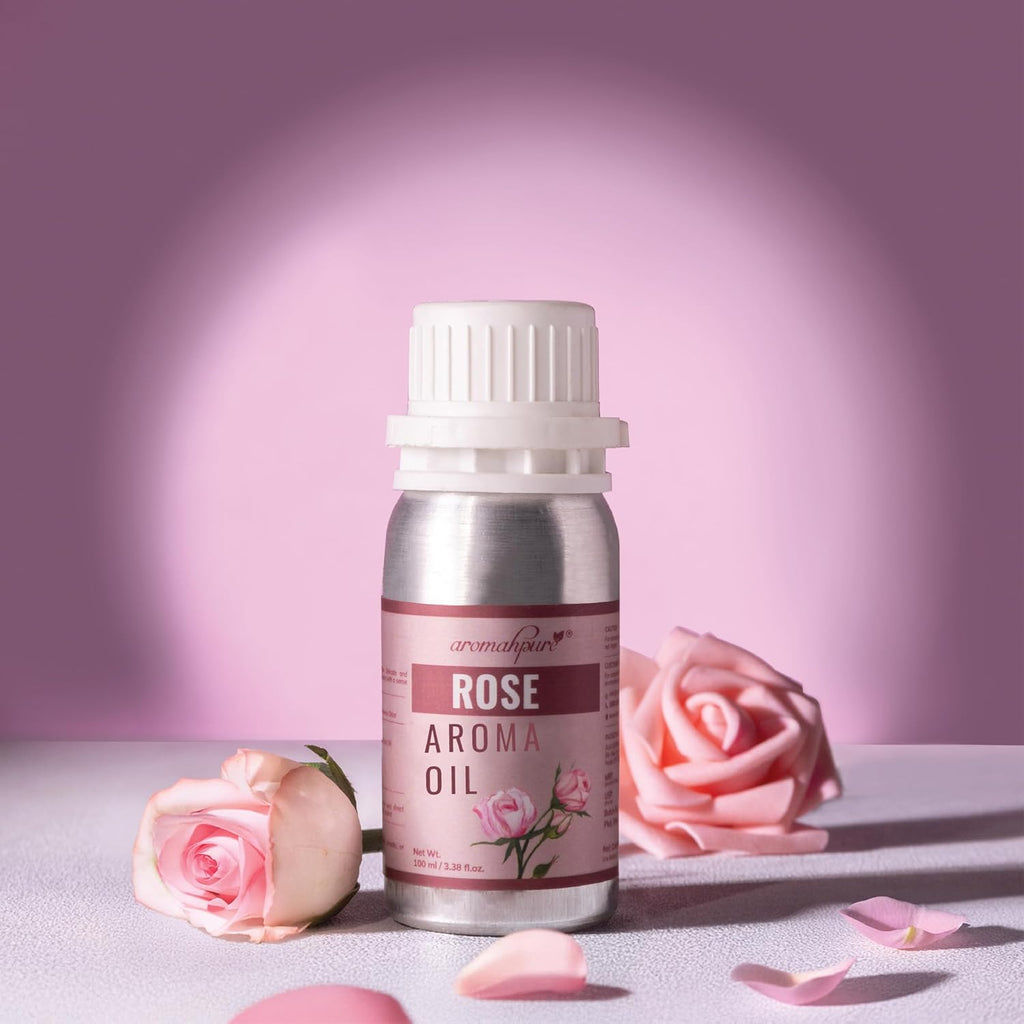 Rose aroma oil bottle with pink roses and petals