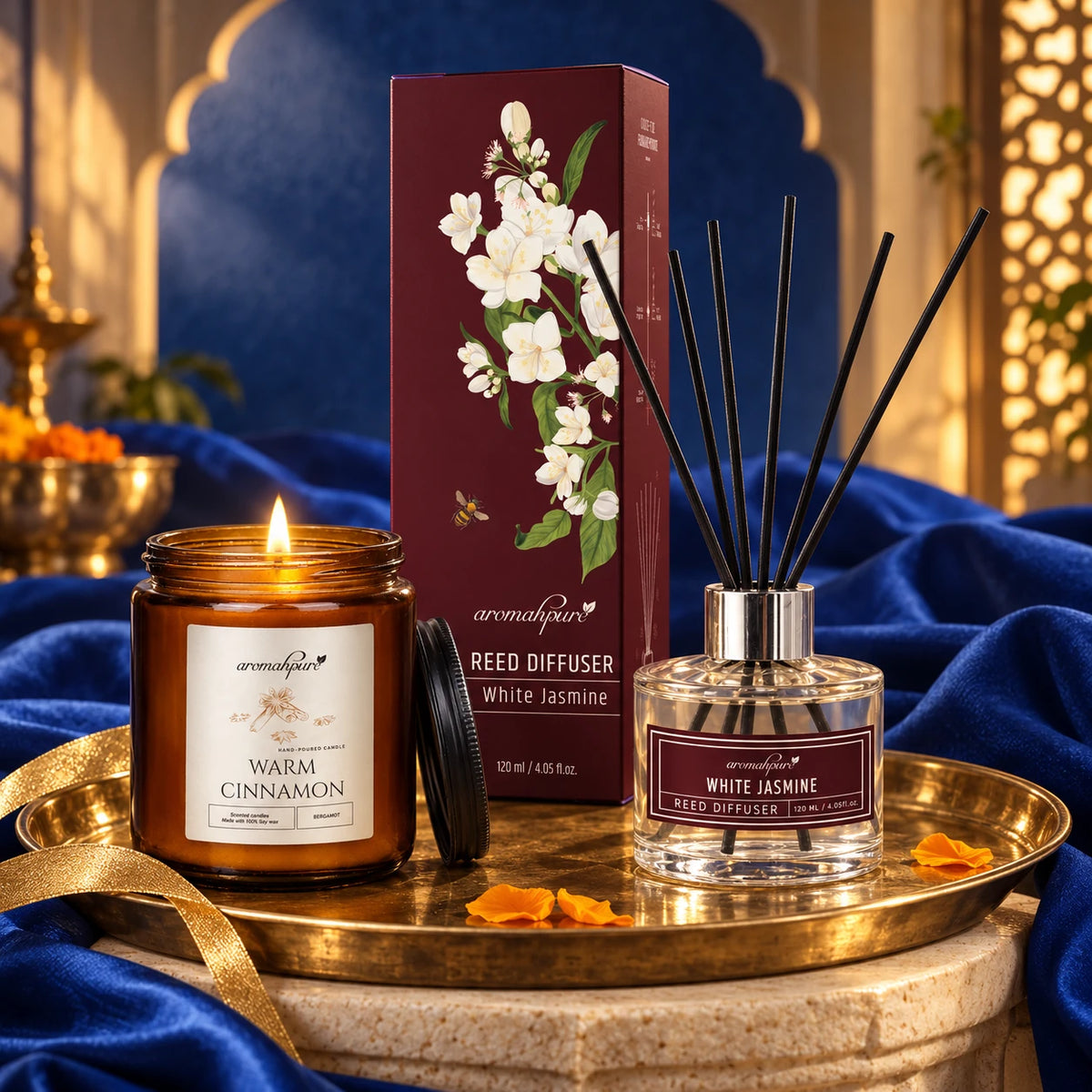 Aromahpure Black Cinnamon candle and White Jasmine Reed Diffuser styled on a brass tray